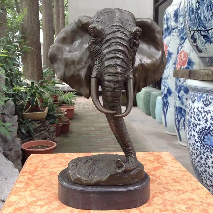 Brass elephant head sculpture