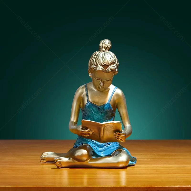 child reading book statue