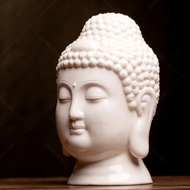 white ceramic buddha head