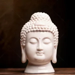 white ceramic buddha head