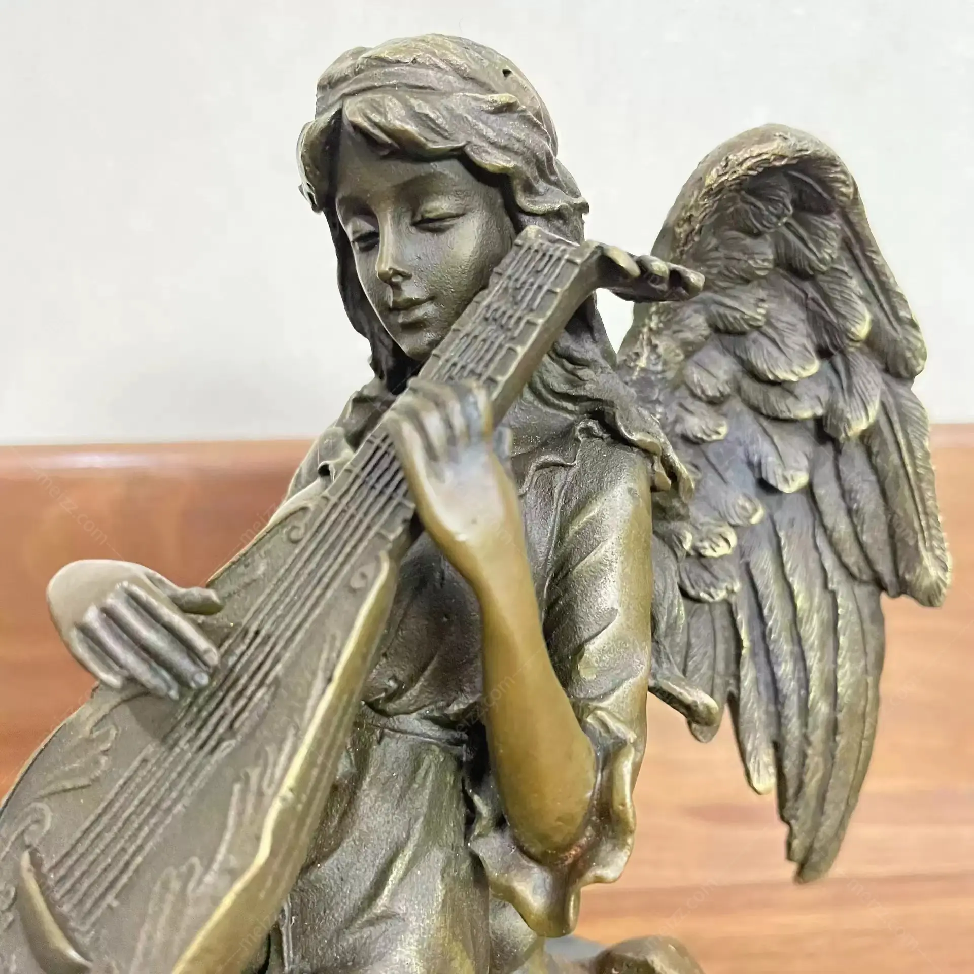 angel playing music sculpture