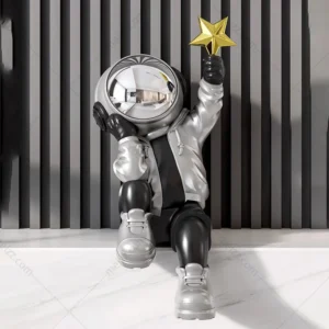 Astronaut star catching figurine sculpture