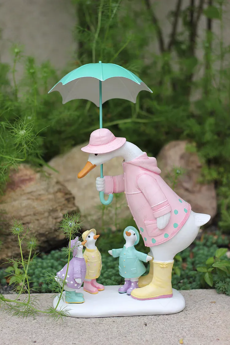 duck with umbrella figurine