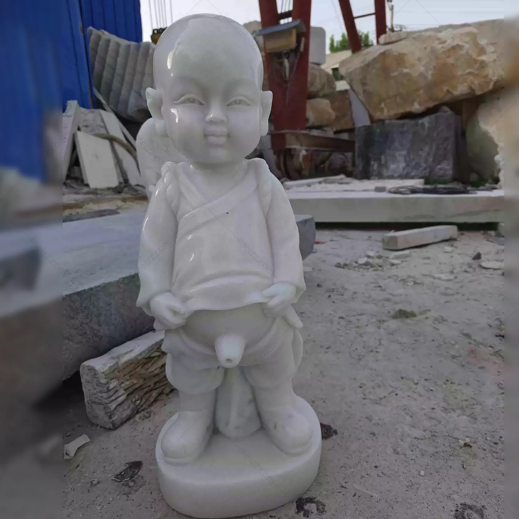 little boy peeing statue