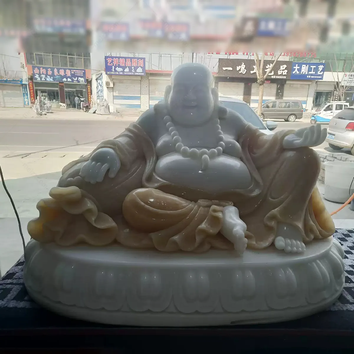 stone happy buddha statue