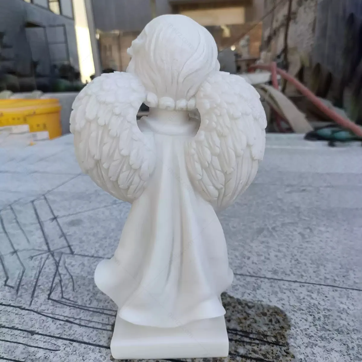 praying cherub statue