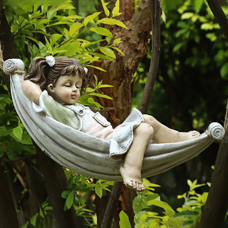 child on hammock statue