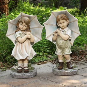 boy and girl with umbrella statue