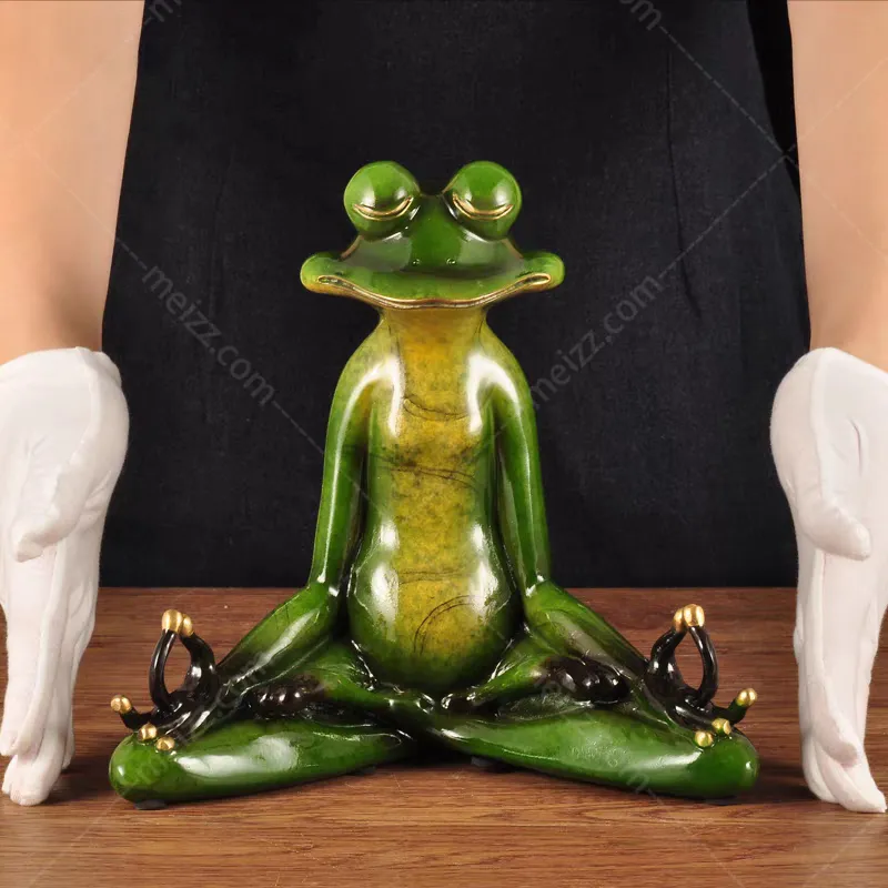 meditating frog statue