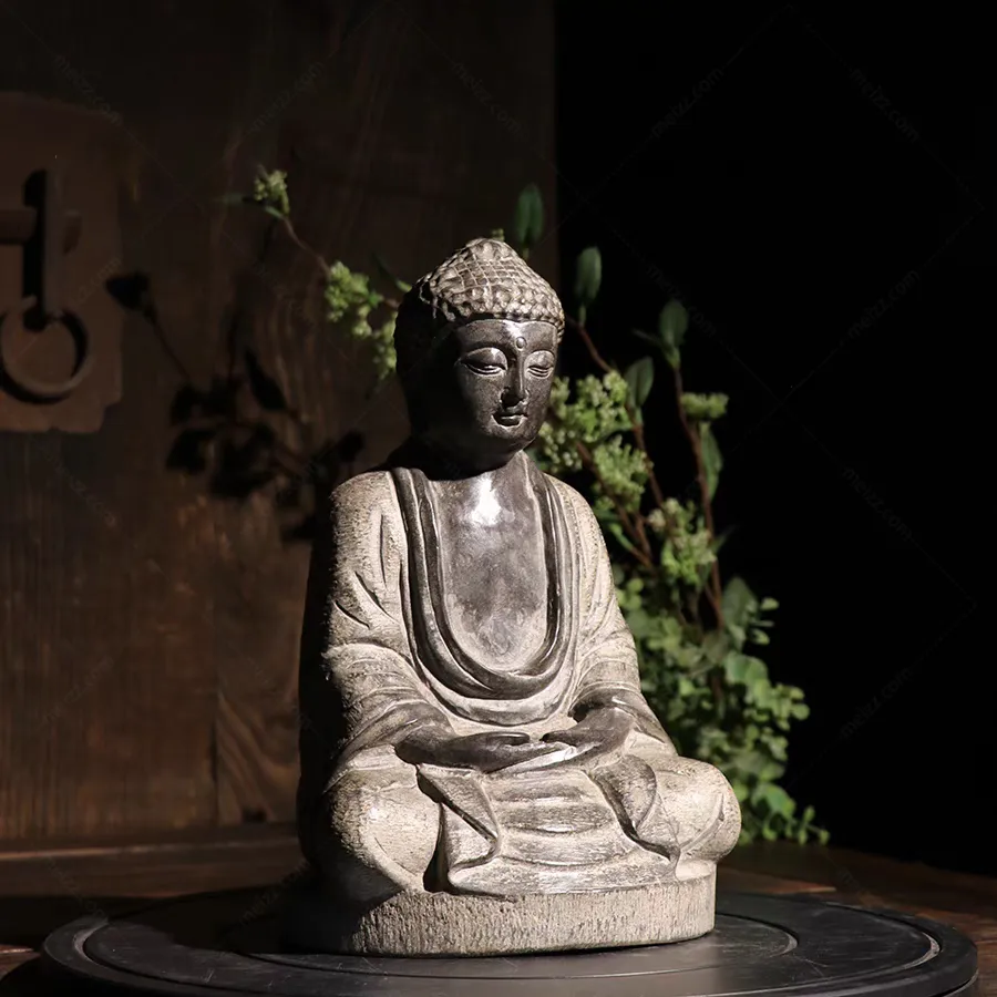 small stone buddha statue