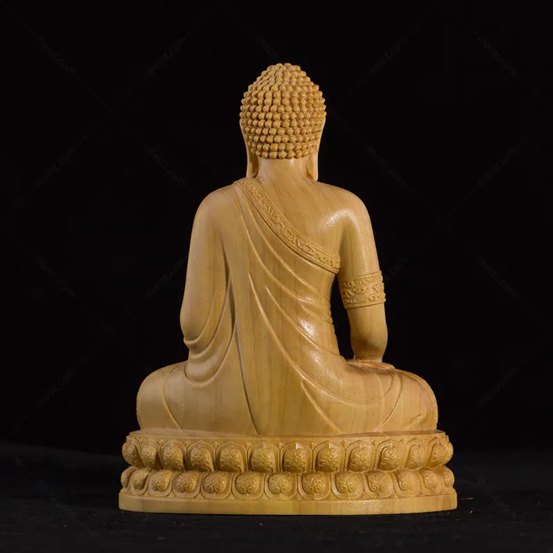 small wooden buddha statue