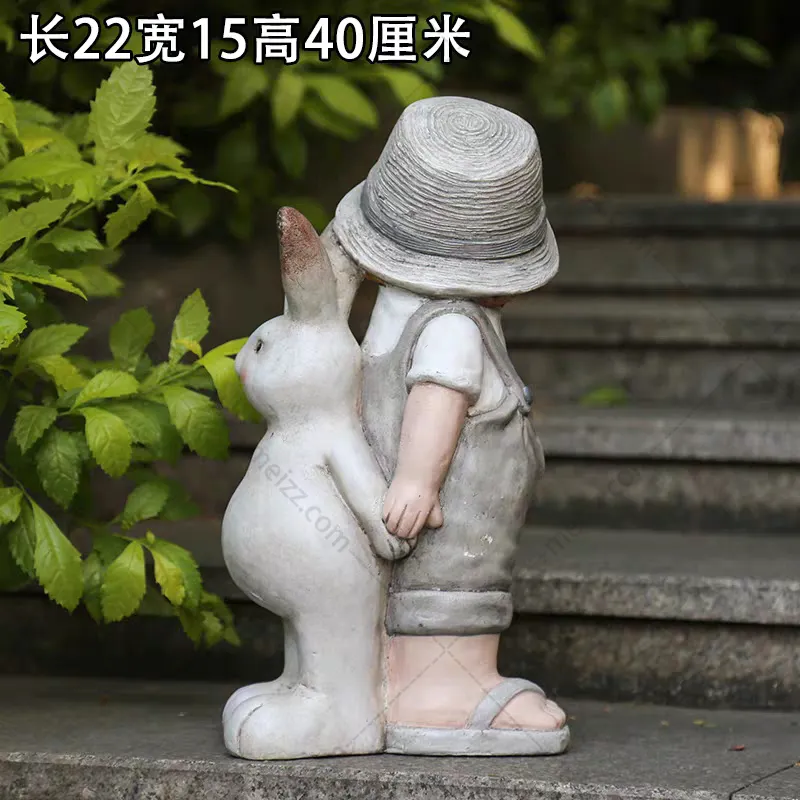 boy and rabbit statue