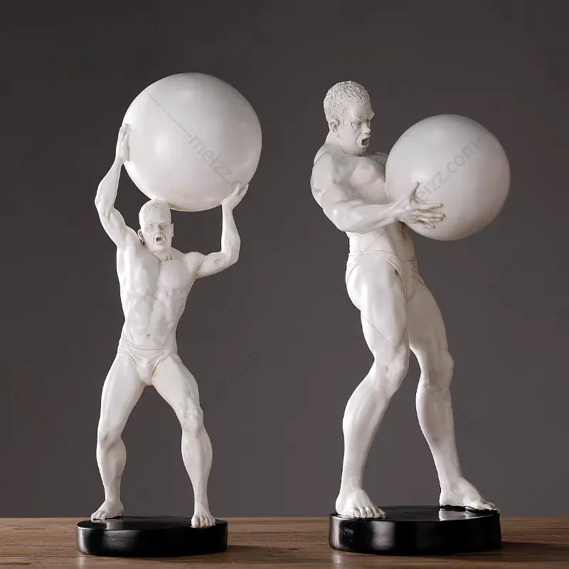 Man Holding Ball Statue