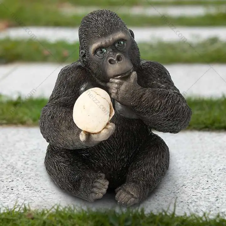 gorilla ornament holding skull