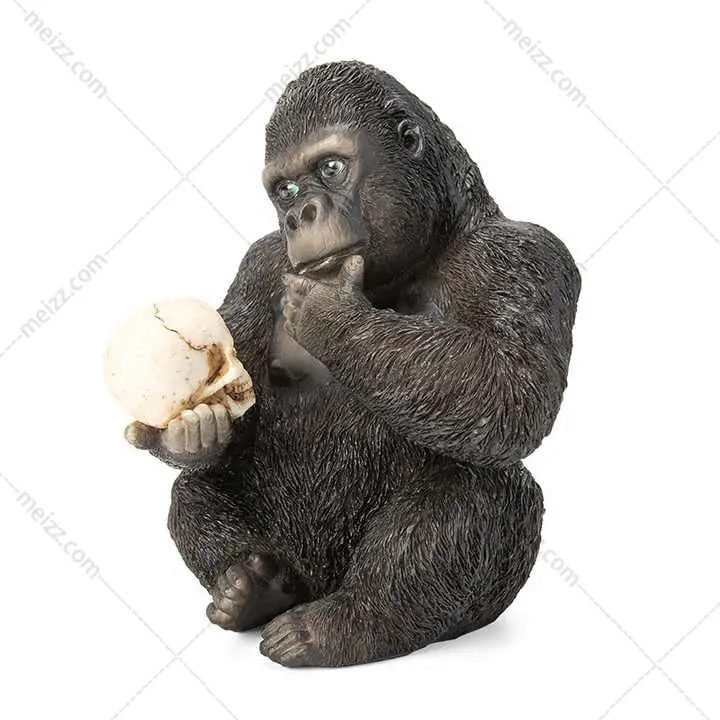 gorilla ornament holding skull